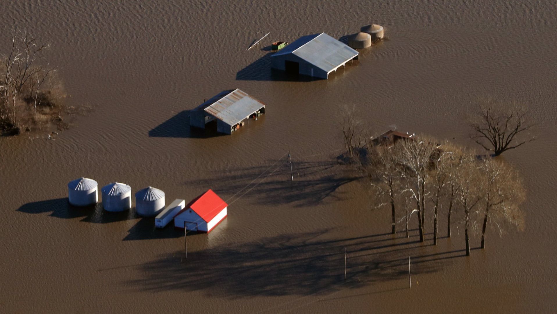 Floodwaters engulf a farm near Missouri Valley on Friday.